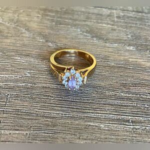 Women’s size 10.5 fashion jewelry ring with purple and faux diamond stones oval